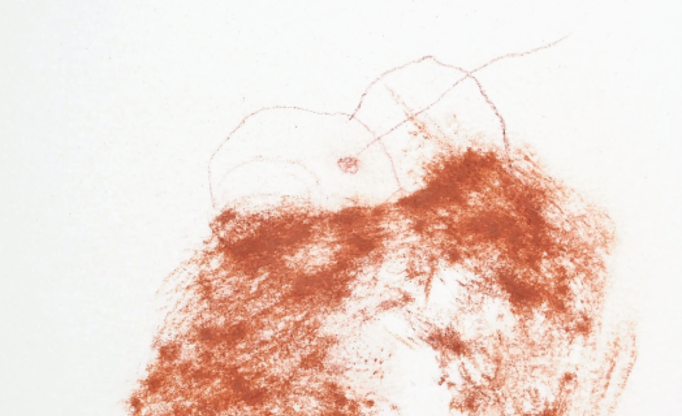 Close-up of a child's hands drawing in a notebook indoors.